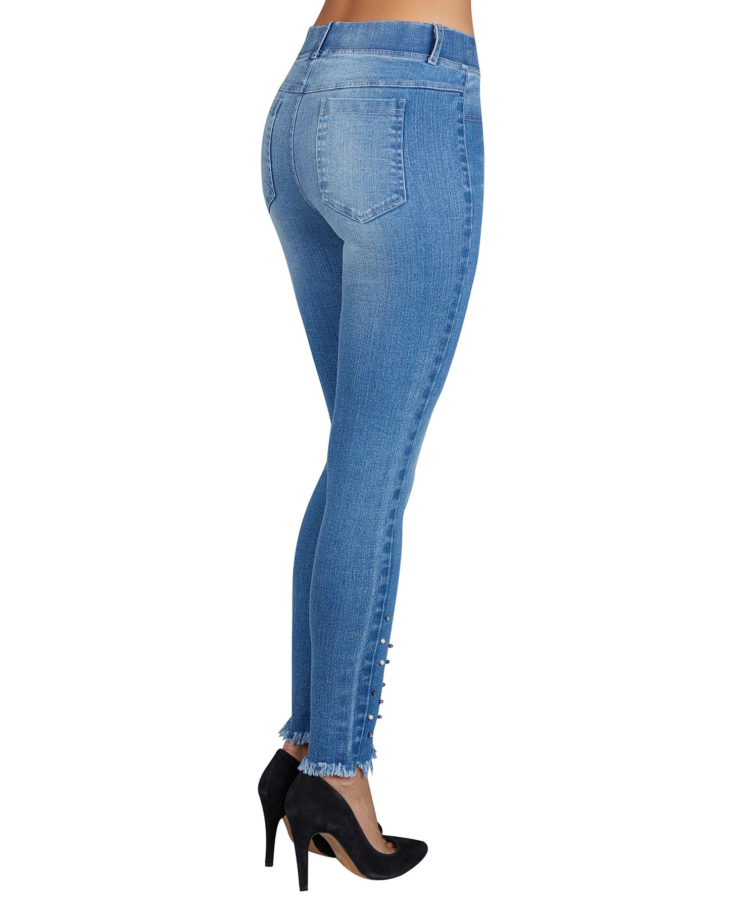 Blue jeans worn by a person on a white background
