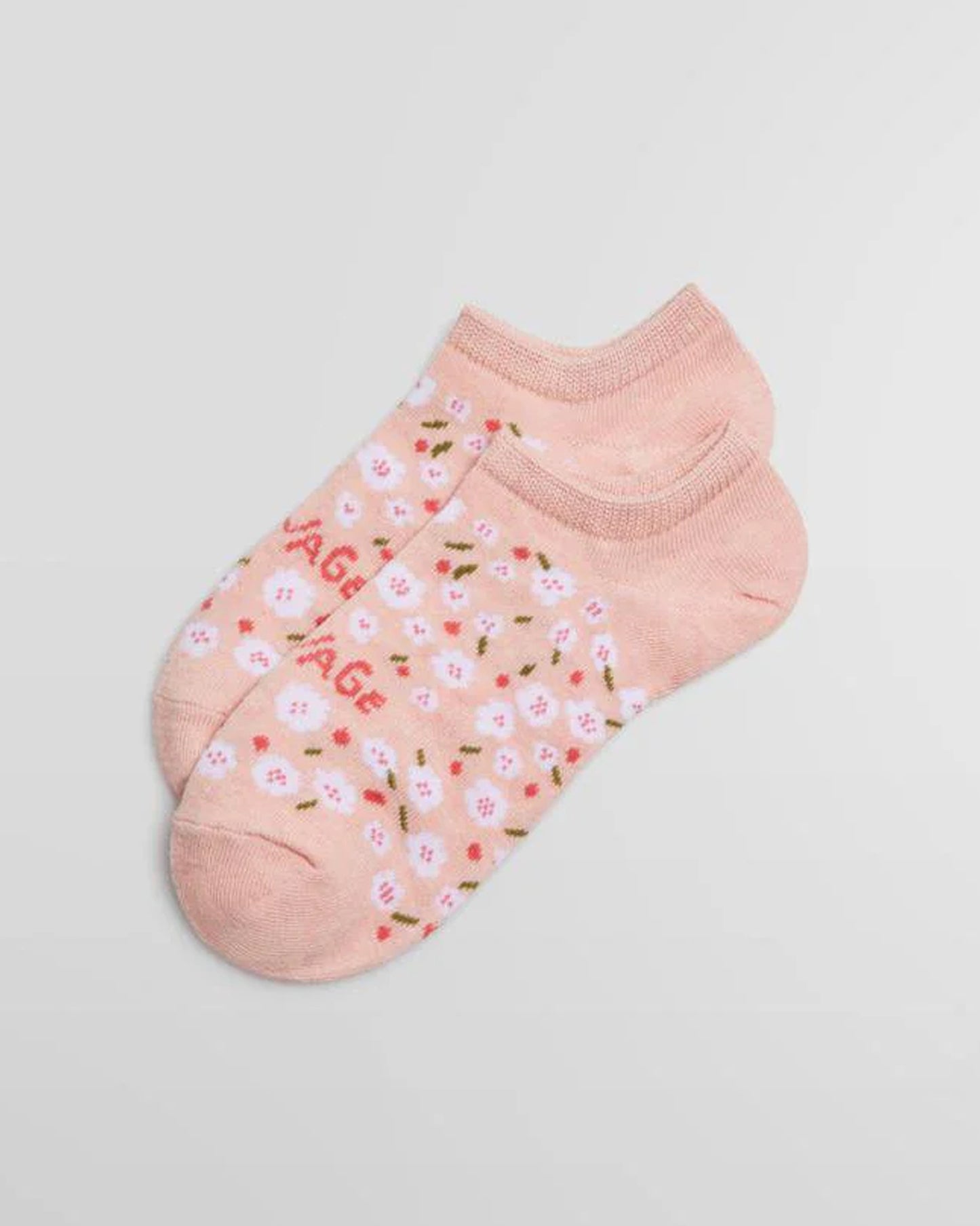 Ysabel Mora 12861 Savage Liners - Light pink cotton low ankle sneaker socks with an all over floral pattern in white and pink and "savage" written across the foot in pink.