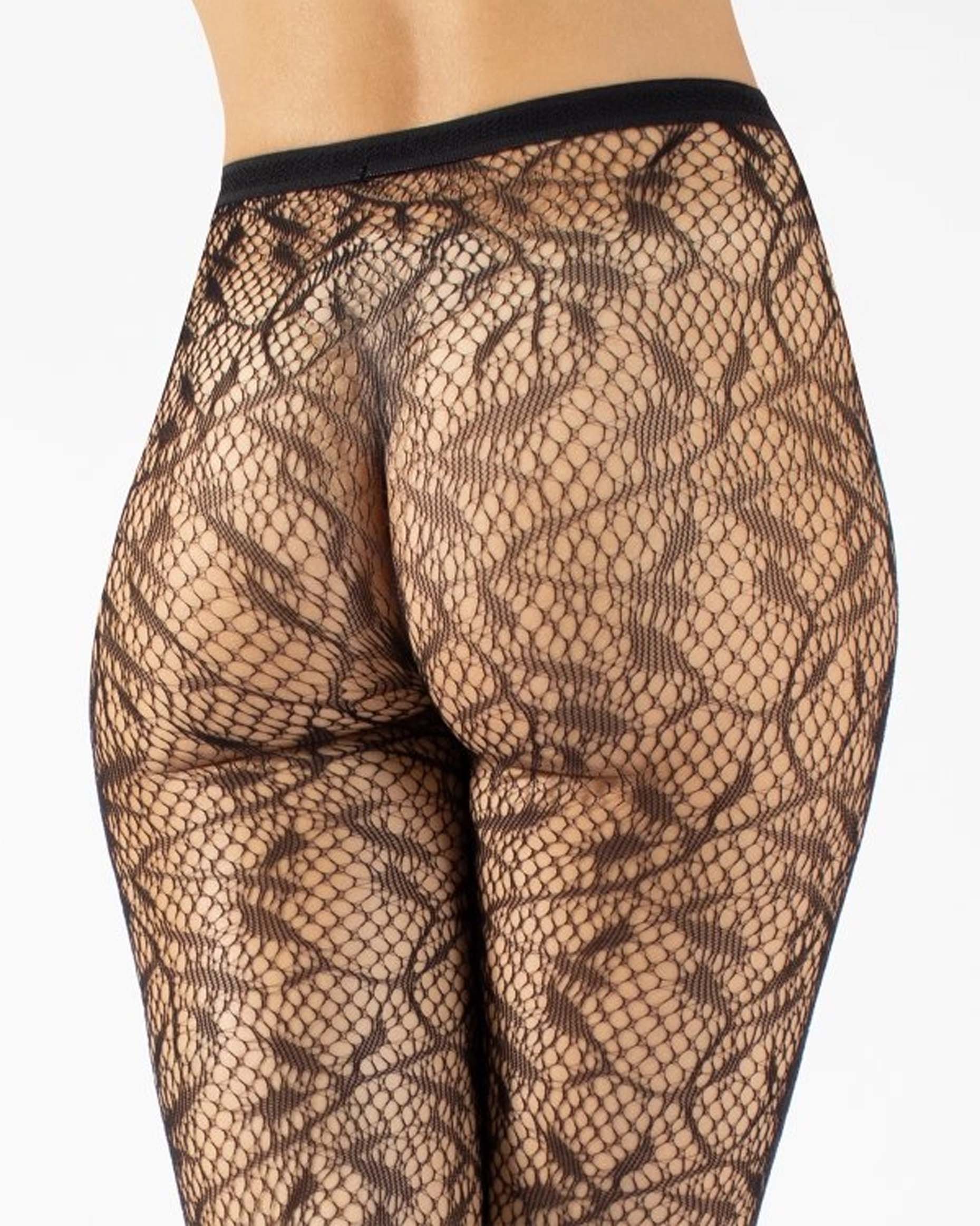 Black fishnet patterned tights on a white background, back view