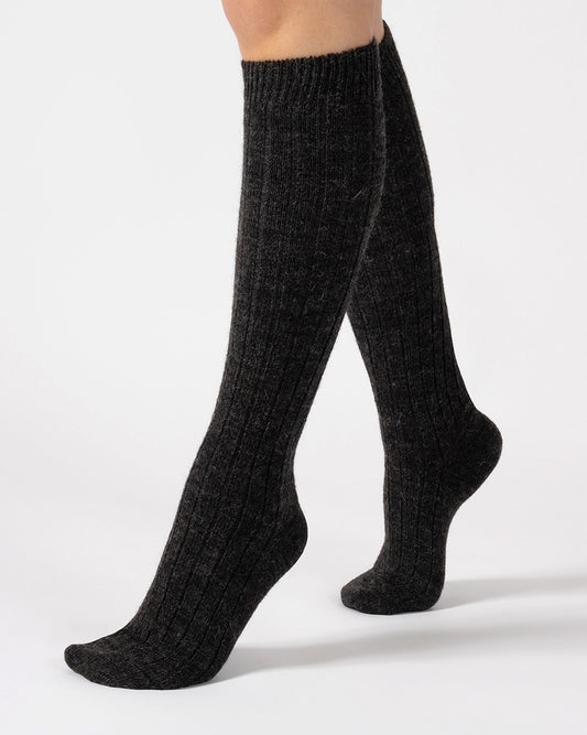 Dark grey knee-high wool socks on a white background