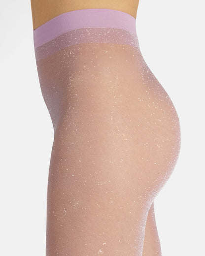 Sheer lilac tights with a silver glittery waistband on a grey background