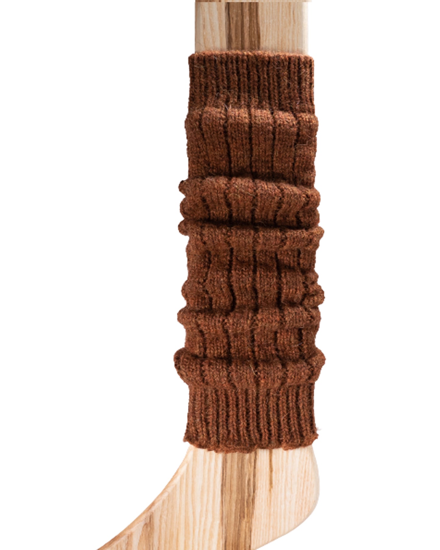 A light brown chunky ribbed knitted leg warmer displayed on a wooden model.
