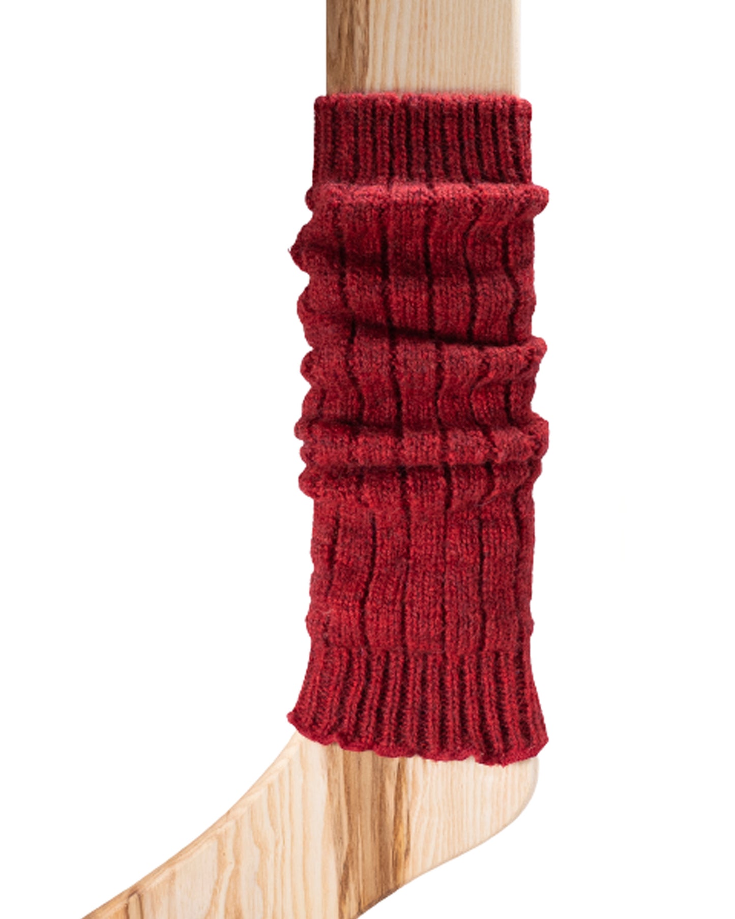 A dark red chunky ribbed knitted leg warmer displayed on a wooden model.
