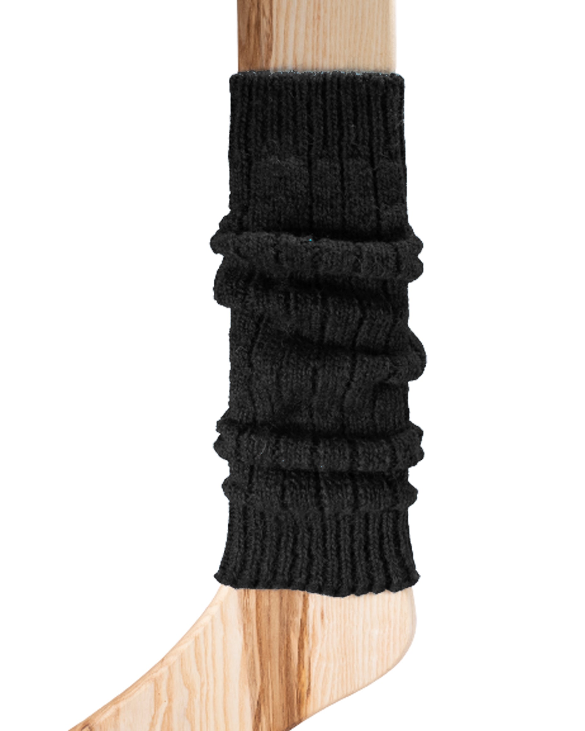 A black chunky ribbed knitted leg warmer displayed on a wooden model.