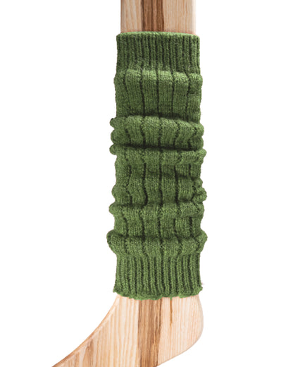A green chunky ribbed knitted leg warmer displayed on a wooden model.