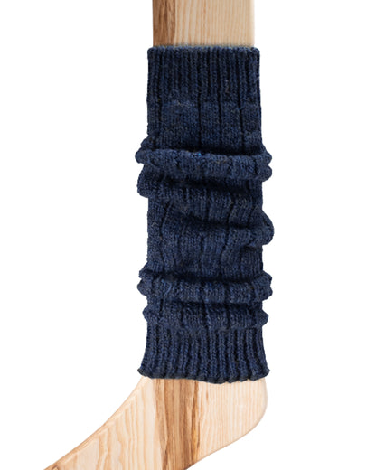 A light navy chunky ribbed knitted leg warmer displayed on a wooden model.