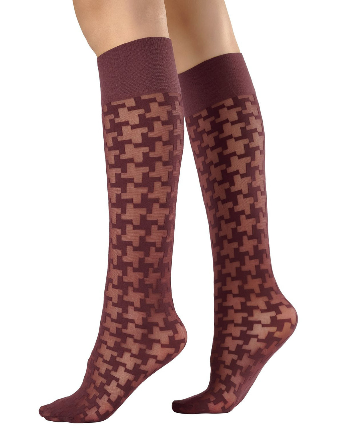 A pair of knee-high socks with a burgundy houndstooth pattern, shown on a model's legs against a plain white background.