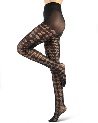Black patterned tights with a fishnet diamond design, shown on a model's legs against a white background.