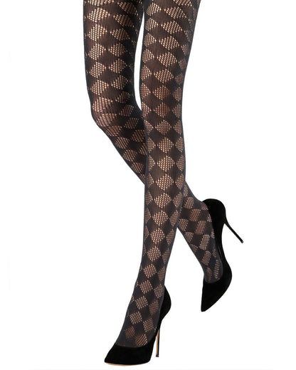 Black fashion tights with a geometric diamond pattern, shown on a model's legs paired with black pointed-toe stiletto heels against a white background.