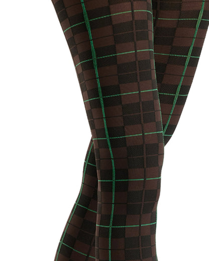 Close-up of a person's legs wearing patterned tights with a dark brown and black checkered design outlined by thin green grid lines, set against a plain white background.
