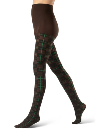 A model's legs wearing brown tights with a green and black tartan plaid pattern, shown from the waist down on a white background.