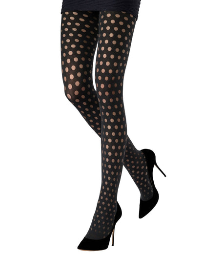 Black opaque tights with a sheer polka dot pattern, shown on a model's legs paired with black pointed-toe high heels against a white background.