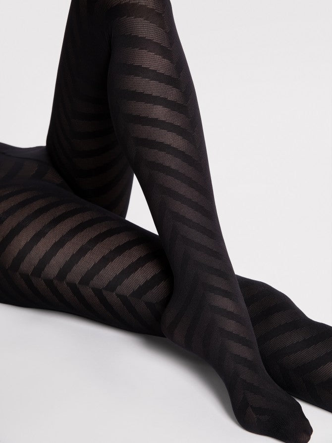 Fiore Black Chance Tights - Close up of black semi-opaque fashion tights with a large linear herringbone style pattern.
