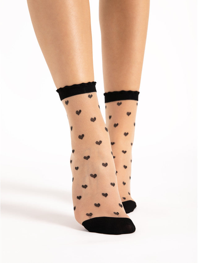 Fiore Iris Sock - Sheer nude fashion ankle socks with an all over black spotted heart pattern and scalloped edged cuff.