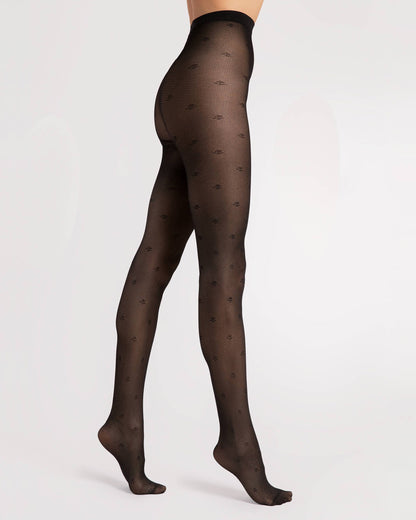 Fiore Lea 30 Den - Black micro mesh fashion tights with a small flower and stem dotted pattern, geometric linear pattern, sheer body and reinforced toe. Side view.