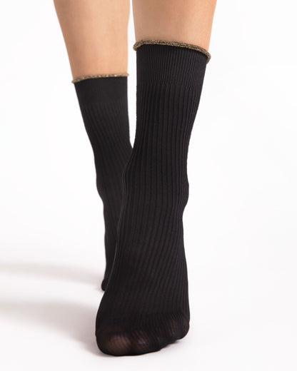 Black ankle-high ribbed socks on a white background
