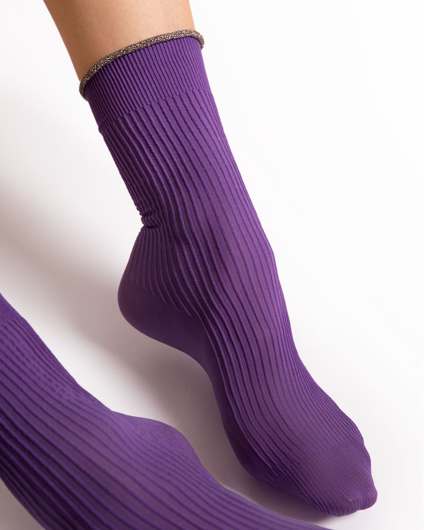 Purple ribbed socks on a white background