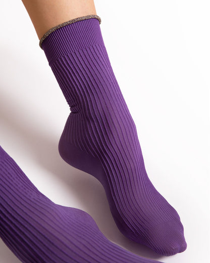 Purple ribbed socks on a white background