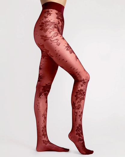Fiore Sharon Tights - Burgundy / dark red semi-sheer micro mesh black fashion tights with a flower and spot pattern, flat seams, hygienic gusset and invisible reinforced toe. Side view.