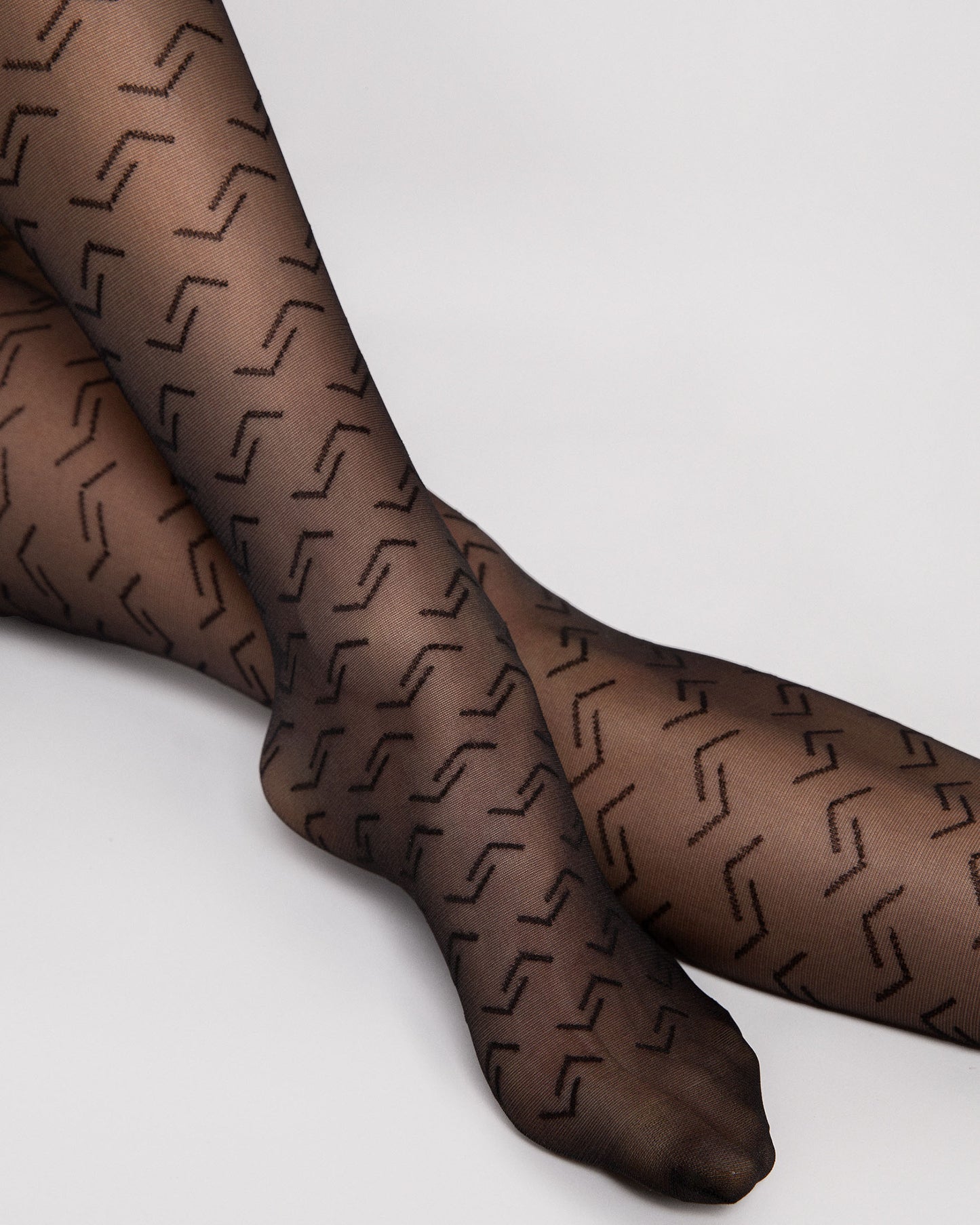 Fiore Staple Tights - Sheer black fashion tights with a geometric linear pattern, reinforced boxer top brief and reinforced toe.
