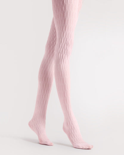 Light pink textured tights worn by a person on a light grey background