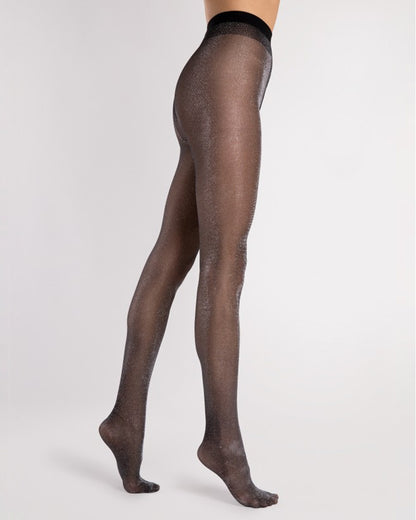Black sheer tights with silver sparkly lamé worn by a person on a white background