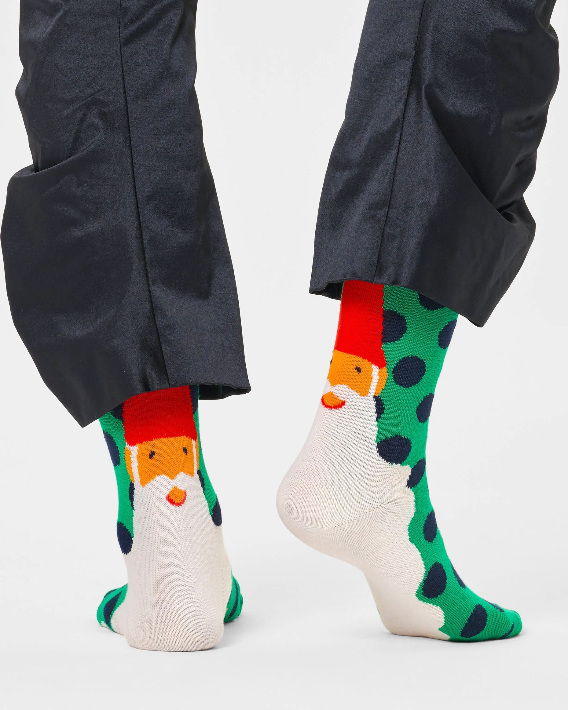 Happy Sock P000258 Santa's Beard Socks - Green cotton crew length socks with navy polka dot pattern and Santa on the back with long white beard. Worn with navy tracksuit pants.