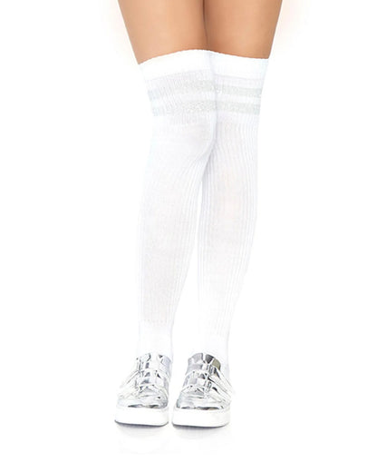 White ribbed knee-high socks worn on legs, paired with shiny silver sneakers, shown against a plain white background.