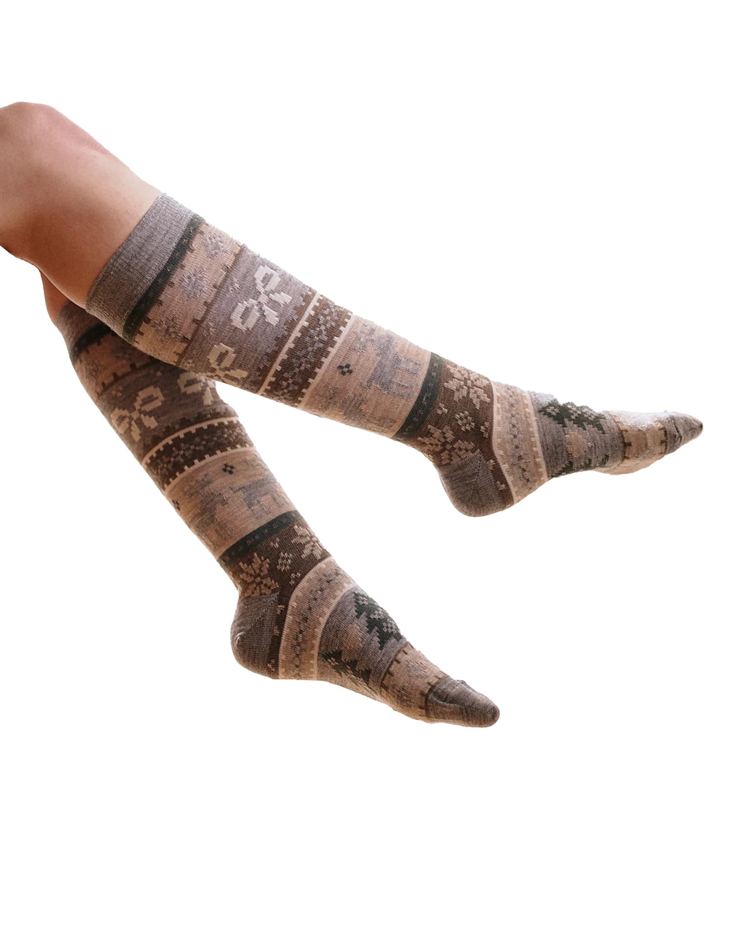 Knee-high socks with a Christmas fairisle style pattern of reindeers, snowflakes, bows, Xmas trees, hearts and diamonds.