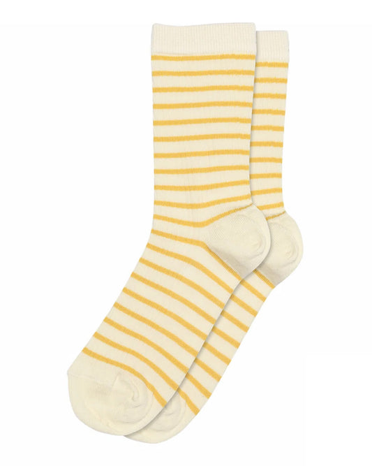 Pair of yellow and white striped socks on a white background