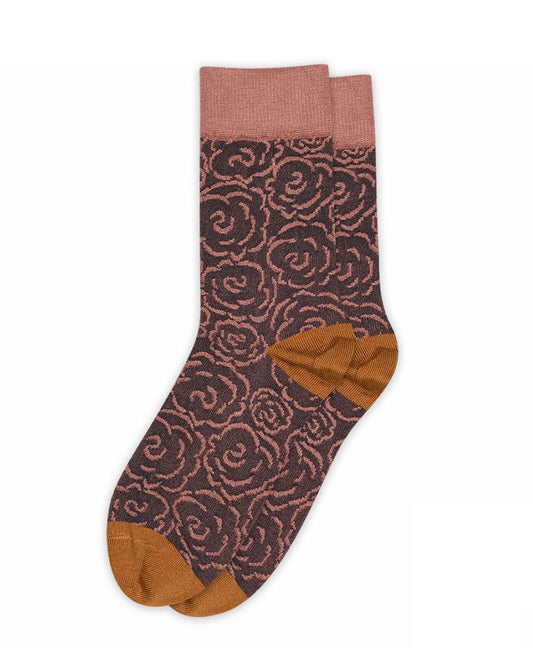 Dark purple crew length ankle socks with a linear rose style pattern in pale pink, pale pink deep cuff, orange heel and toe.
