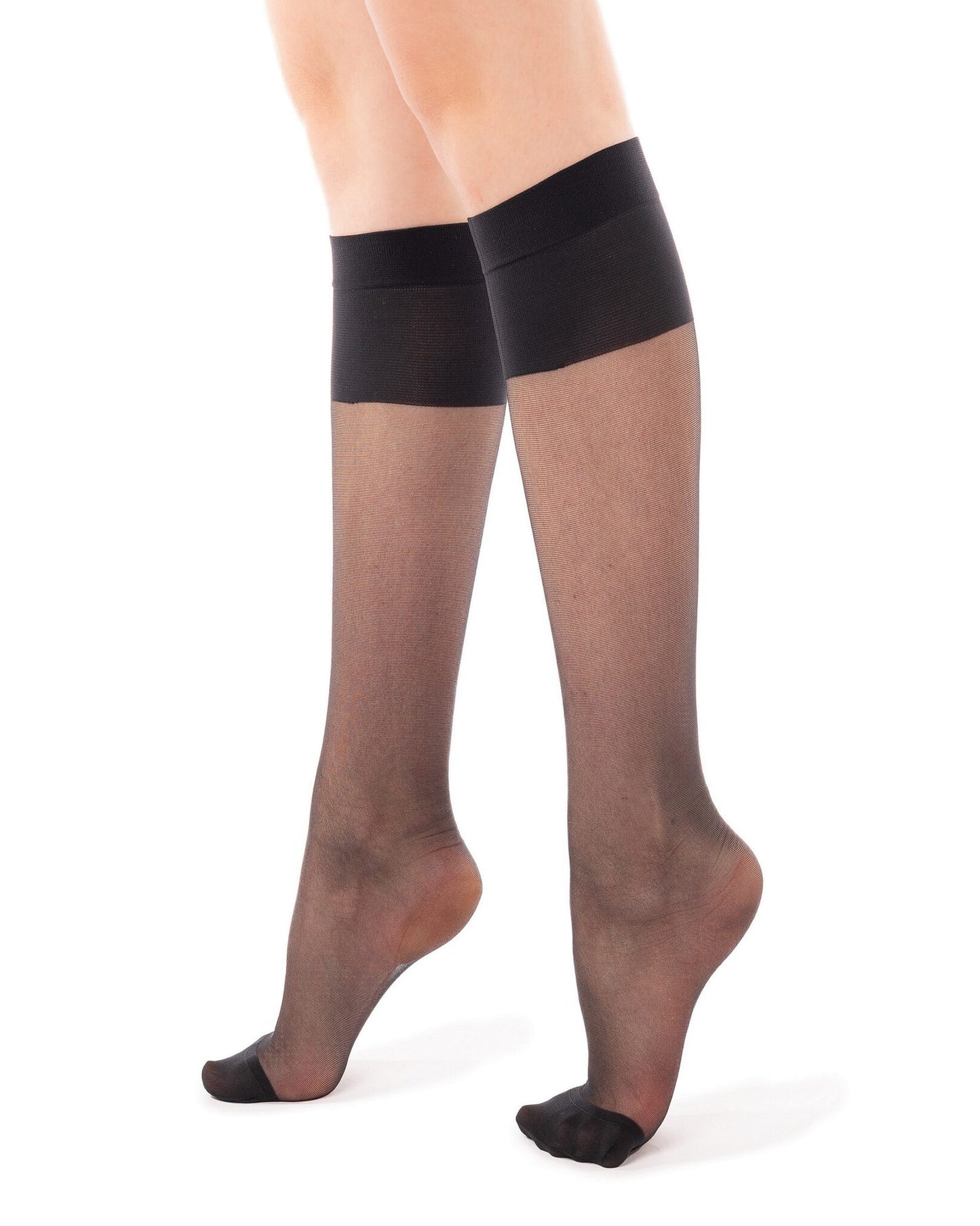Sheer black knee-high socks worn by a person on a white background