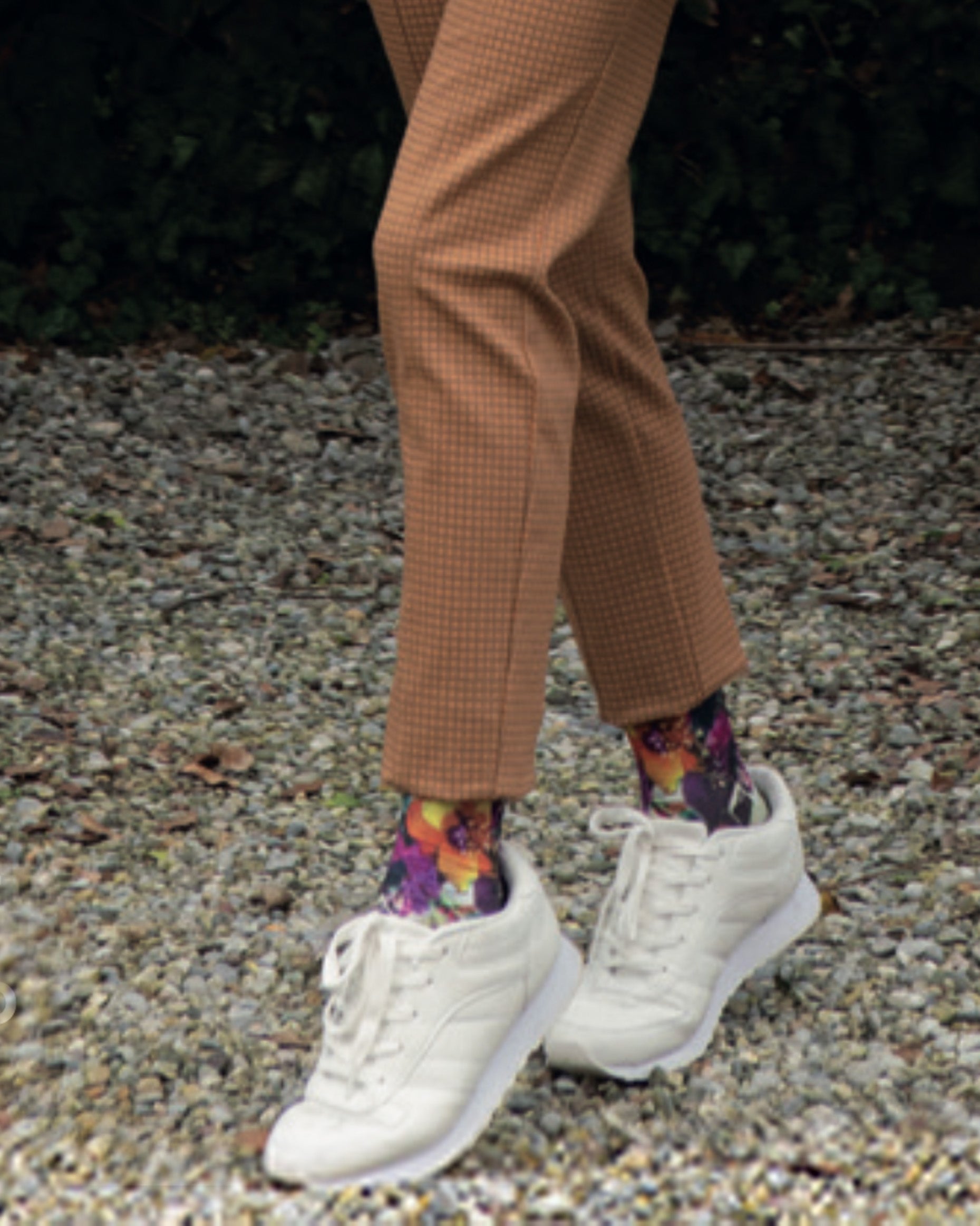 Omero Fantasy (Flowers) Calzino - Opaque fashion ankle socks with an all over digital print of colourful flowers, worn with camel pants and white trainers.