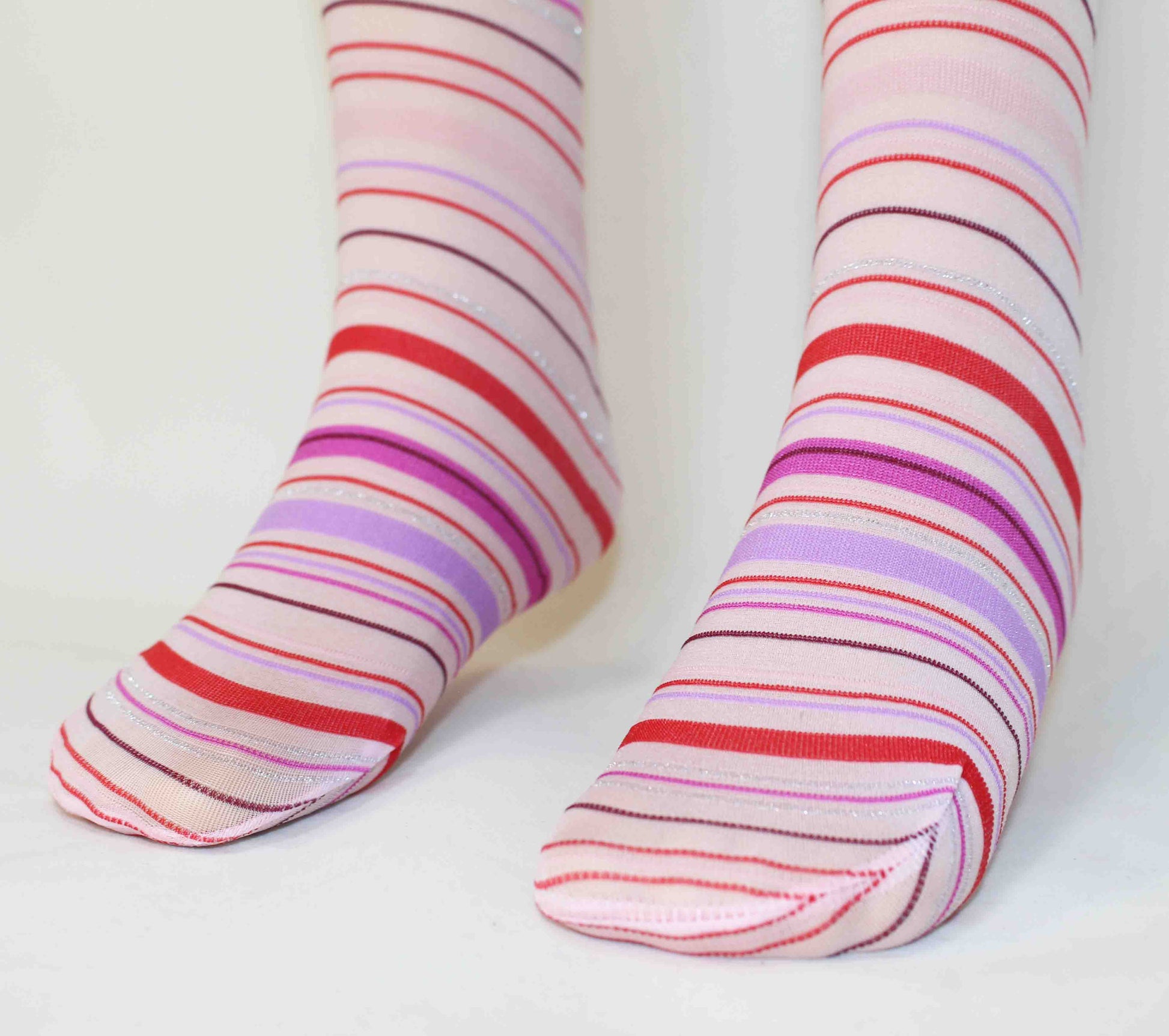 Omsa Crayons Kid's Tights detail - Light pink soft opaque children's fashion tights with a horizontal striped pattern in red, lilac, pink, dark purple and silver.