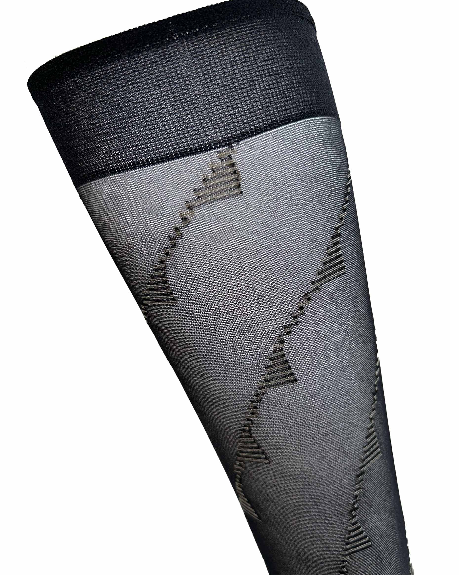 Omsa 3316 Frame Gambaletto - Sheer black fashion knee-high socks with a nude diagonal linear pattern swirling around the leg.