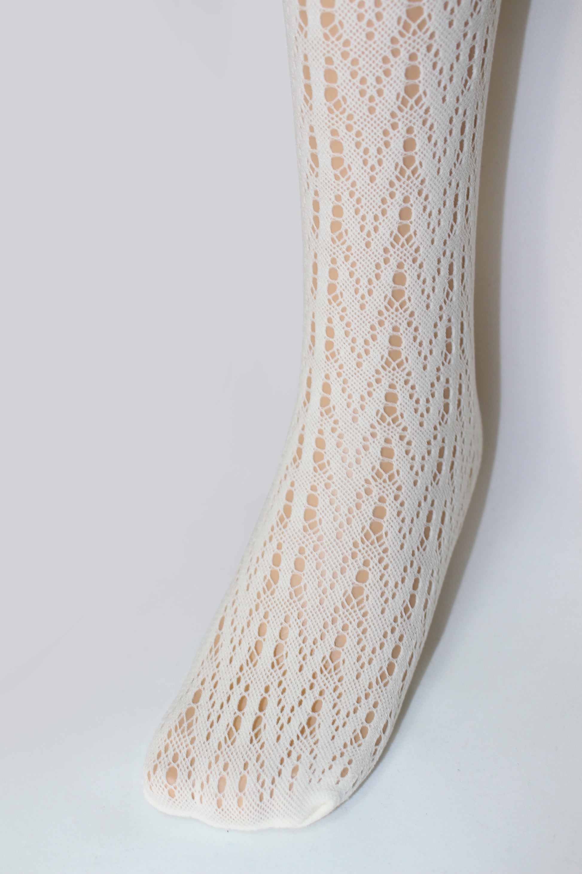 Omsa Incanto Pantacollant - Soft cream openwork chevron crochet style lace kid's tights.