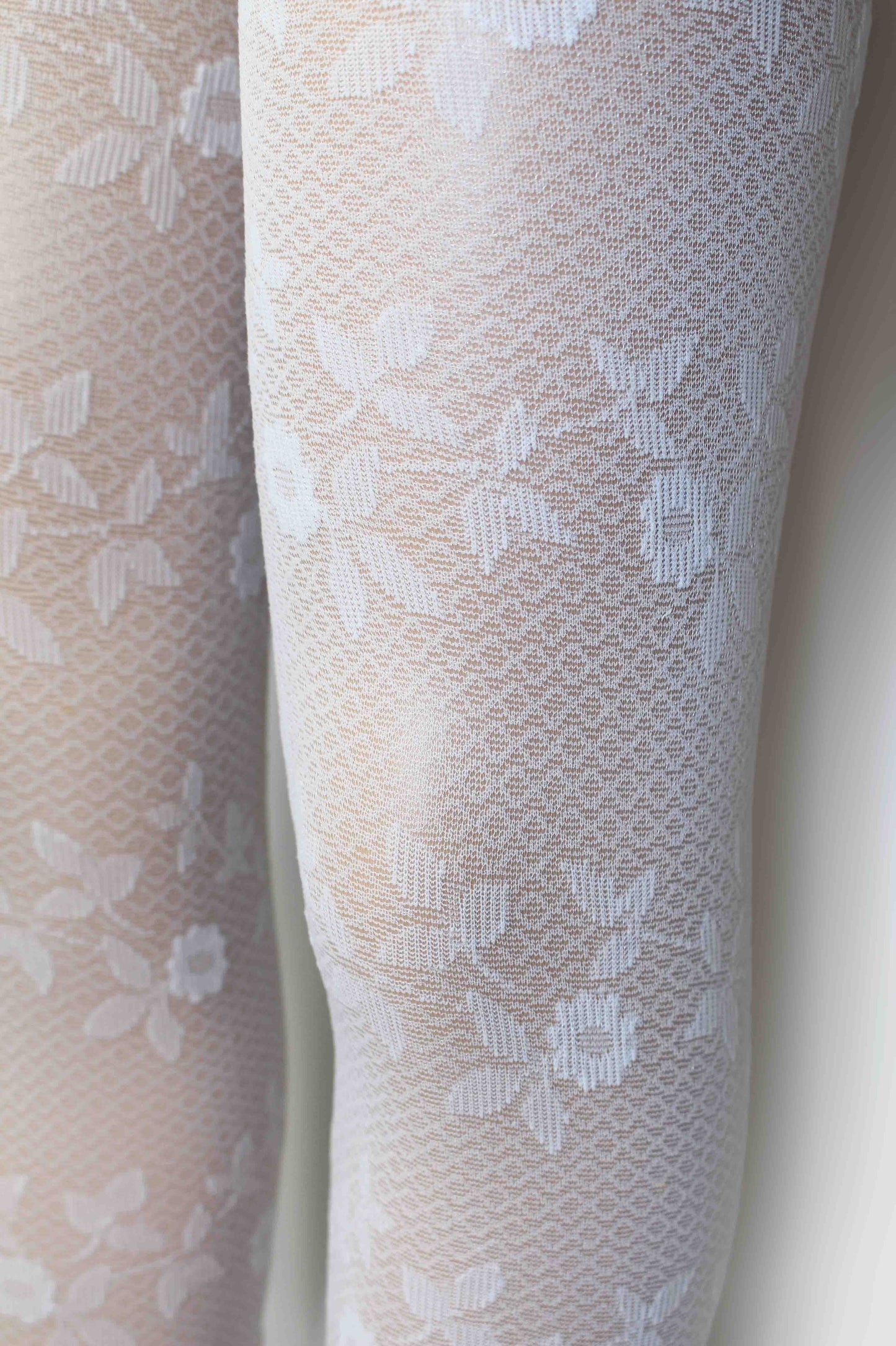 Omsa Serenella Lovely Collant - White semi sheer micro diamond patterned children's fashion tights with an all over woven floral design, perfect for flower girls or first holy communion.