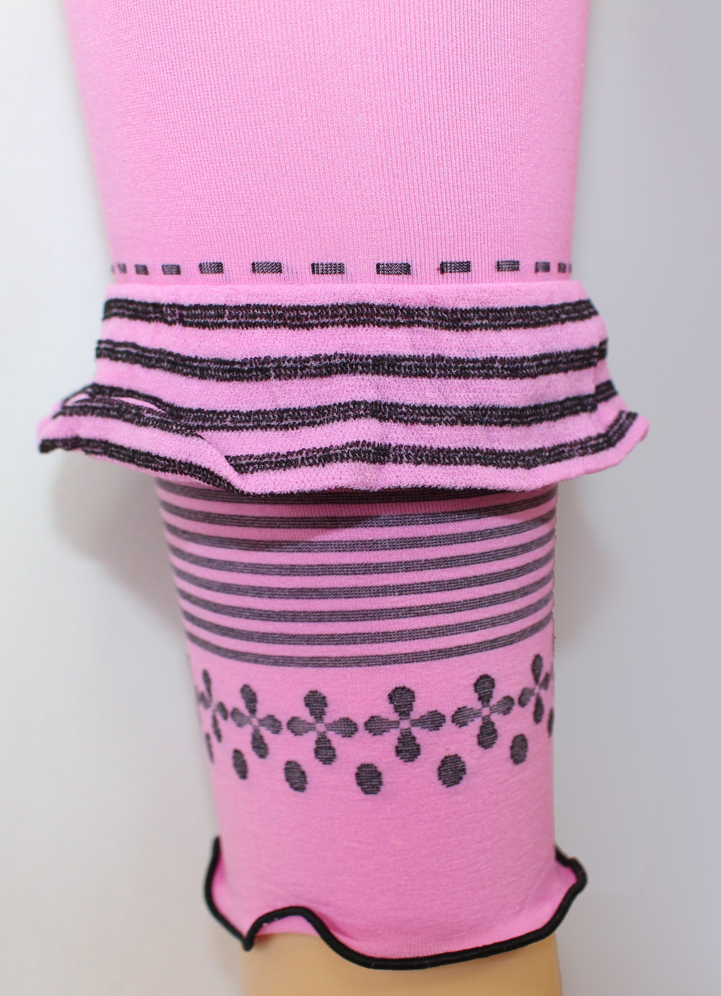 Omsa Outline Detail - Soft mauve pink opaque kid's footless tights leggings with a black horizontal striped ruched frill, striped and floral pattern edge.