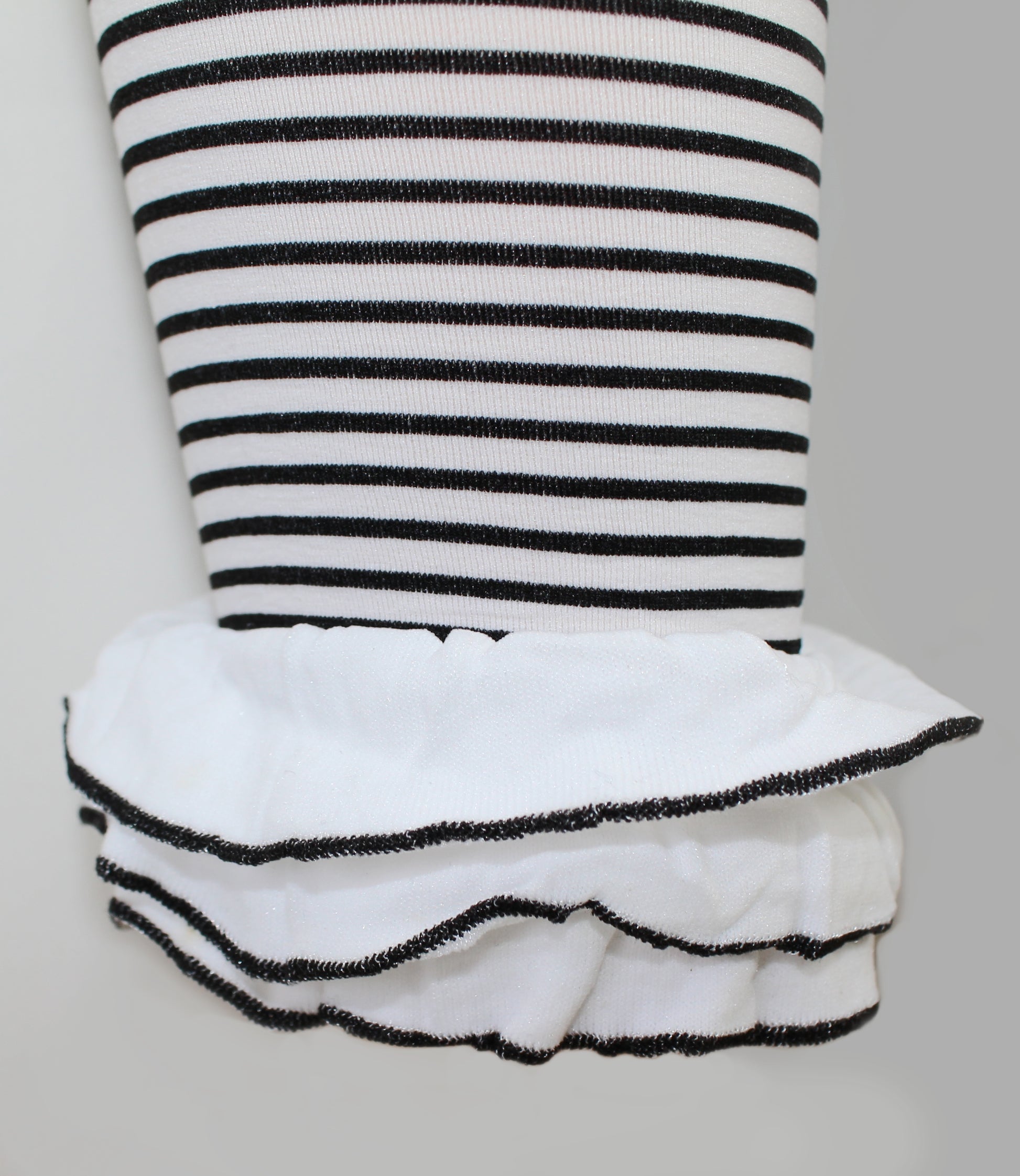 Omsa St. Tropez Pantacollant - Soft white opaque kid's footless tights with a black horizontal stripe pattern and frilly ruched cuff.