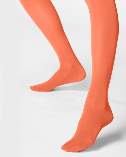 Orange tights worn by a person on a light gray background