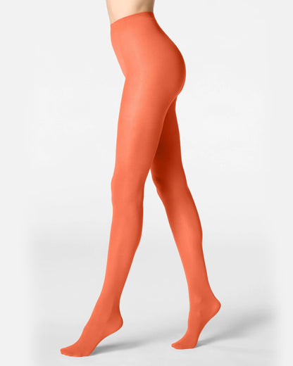 Orange tights worn by a person on a light gray background
