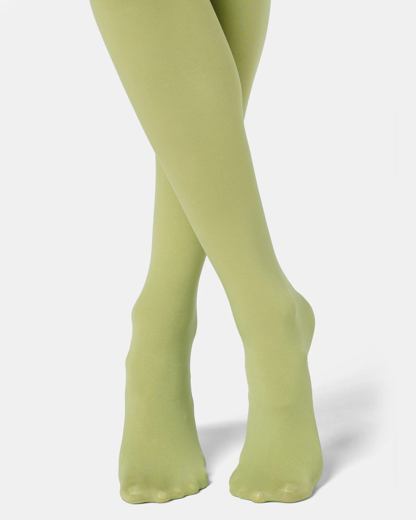 Green tights worn by a person on a white background