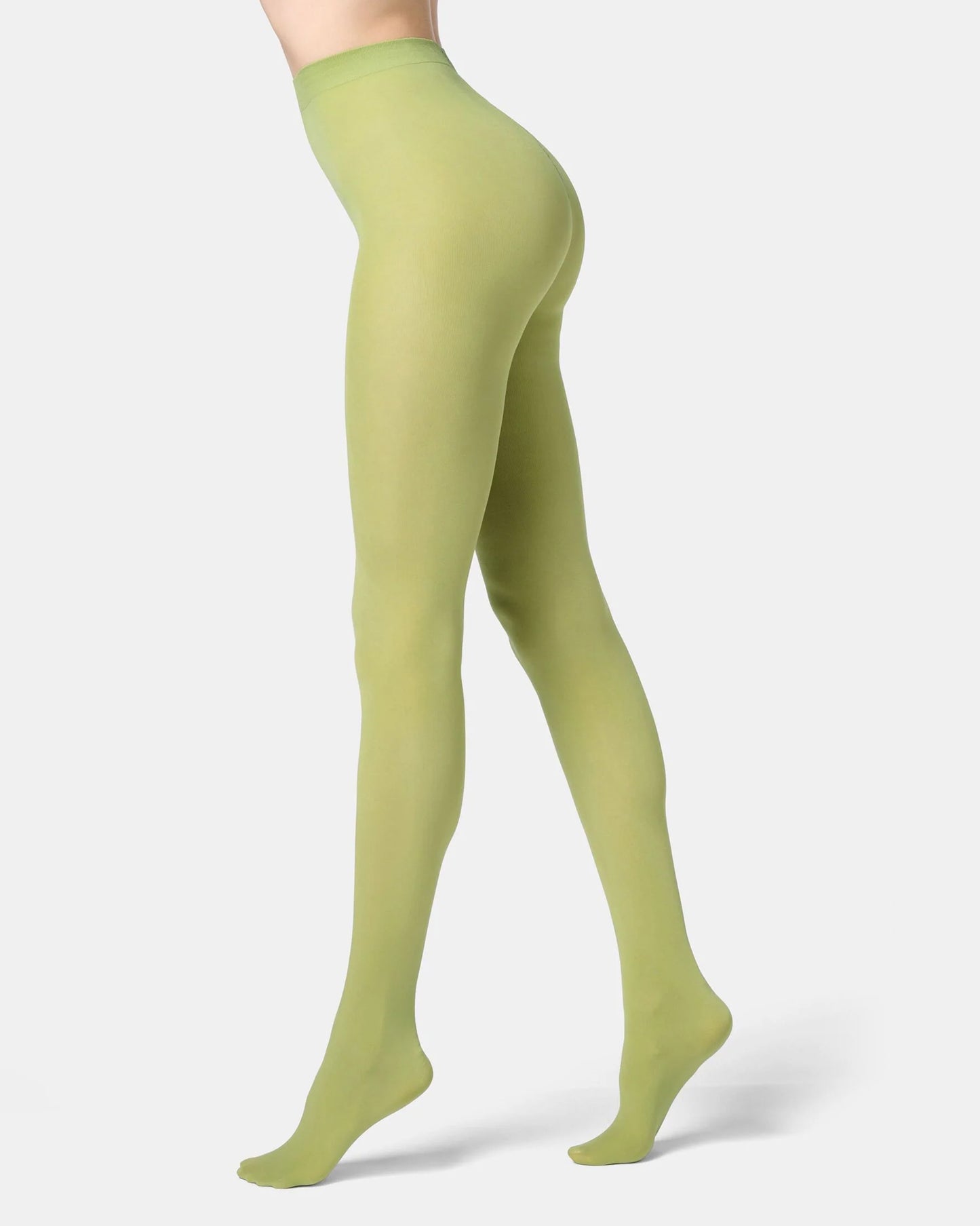 Green tights worn by a person on a white background
