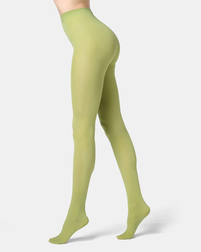 Green tights worn by a person on a white background