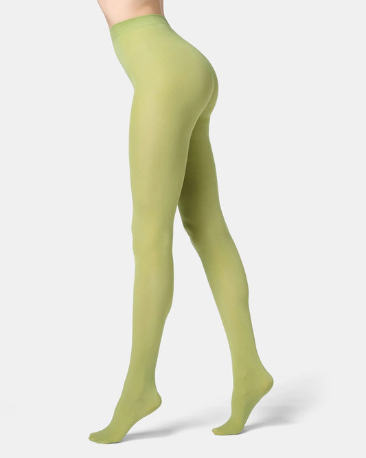 Green tights worn by a person on a white background
