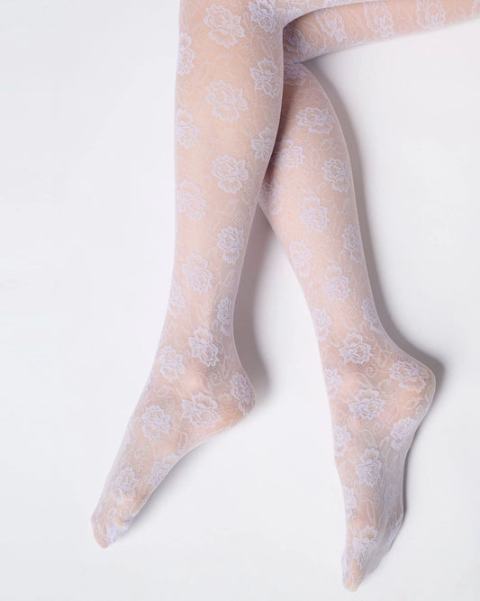 Sheer lilac floral patterned tights on a white background