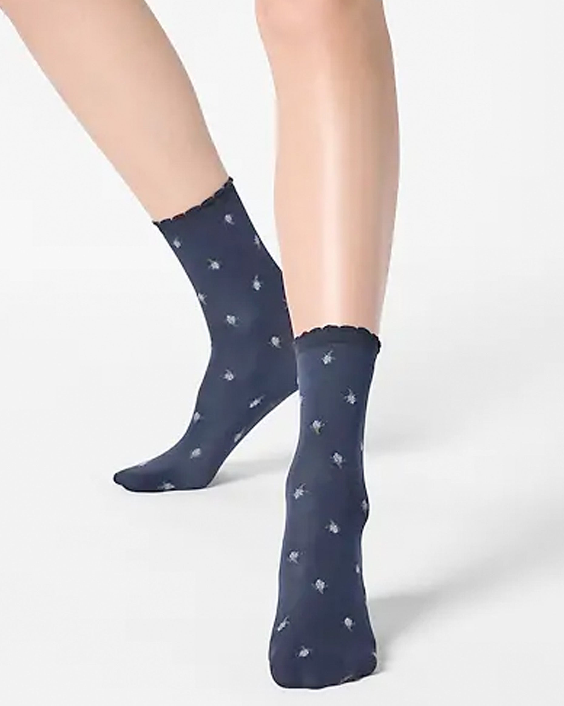 Navy opaque fashion ankle socks with a light blue flower pattern.