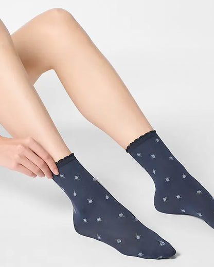 Navy opaque fashion ankle socks with a light blue flower pattern.