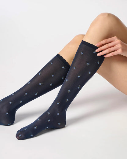 Navy semi-opaque knee-high socks with blue flower pattern.