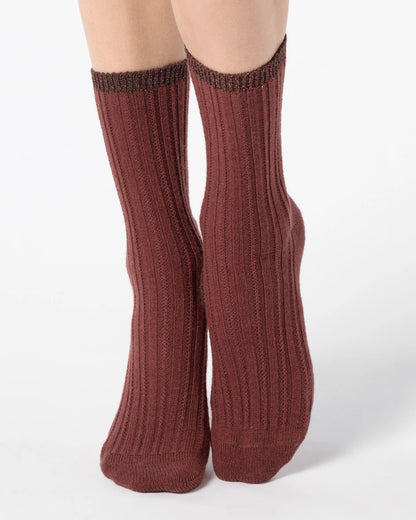 Maroon/brick red/brown ribbed socks with sparkly lamé cuff on a white background